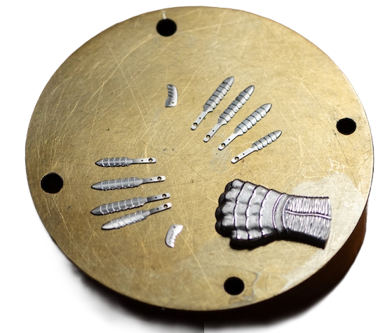 Titanium hand components during the engraving and assembly process
